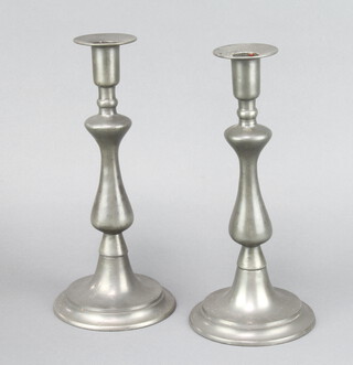 A pair of 19th Century baluster shaped pewter candlesticks 29cm h x 13cm w