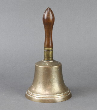 A 19th Century bell metal handbell with turned fruitwood handle, bell marked W H Tang, 24cm x 12.5cm diam.  