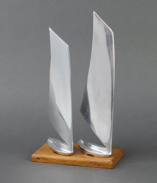 An Art Deco chrome and teak trophy/sculpture in the form of 2 racing yachts, raised on a rectangular base 29cm h x 16cm w x 10cm d 