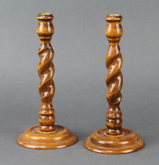 A pair of 1930's spiral turned light oak candlesticks with gilt metal sconces 25cm x 12cm  