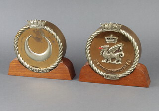 Two brass and chrome naval tompions marked Regent and Crescent, raised on teak bases 21cm h x 23cm w x 4cm d 