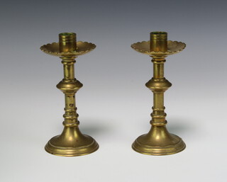 A pair of 19th Century brass candlesticks with shaped sconces 17cm x 8cm 