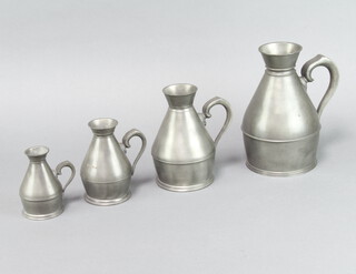 Four 19th Century Irish waisted pewter measures, the bases marked Austen & Sons, Cork, 94 North Main street