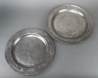 A 17th/18th Century circular pewter plate with London touch mark 38cm (slight tear), 1 other 35cm 