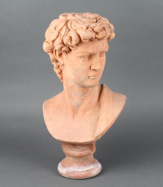A terracotta coloured concrete head and shoulders portrait bust, raised on a socle base 41cm h, the back marked Quest 1949? 