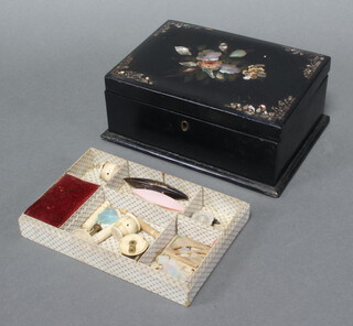 A Victorian black lacquered sewing box with hinged lid containing various bone sewing implements 8cm x 21cm x 5cm (hinge f)