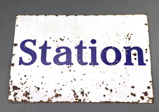A white and blue enamelled sign marked Station 71cm h x 102cm w 