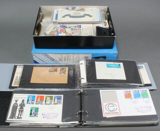 Two albums of GB first day covers together with a box file and a shallow box containing first day covers and a small collection of loose GB stamps 