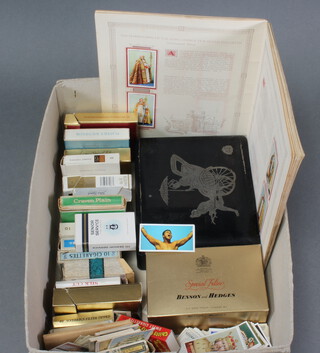 A quantity of loose cigarette cards including Jeffrey Phillips, John Player and others and a collection of vintage cigarette packets