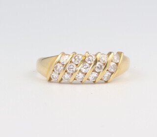 A 18ct yellow gold diamond cross over ring 3.4 grams, size O 