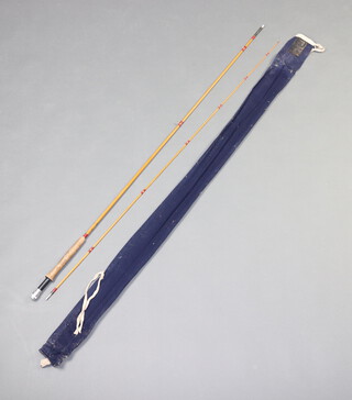 A Hardy 8'9" two piece split cane fly fishing rod "The Palicona" contained in a blue cloth bag 