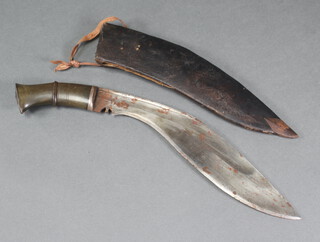A Kukri with 31cm blade, horn grip and leather scabbard 