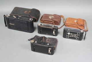An Eastman Kodak no.3 folding camera, 2 Eastman Kodak no.2 folding autographic Brownie cameras and a Kodak Jiffy Six 20 folding camera   