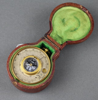 A pocket aneroid barometer, the silvered dial marked Harrods Ltd London (possibly missing glass) contained in a leather carrying case 5cm 