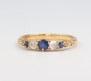 A yellow metal 18ct sapphire and diamond ring 2.8 grams, size N 