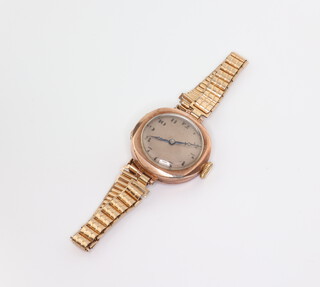 A lady's 9ct yellow gold wristwatch on a gold plated strap 