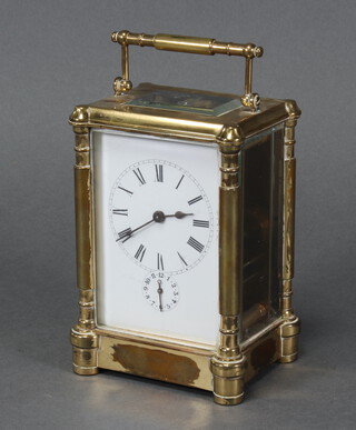 A 19th Century French 8 day carriage alarm clock with enamelled dial and Roman numerals contained in a gilt metal case 13cm x 9cm x 7cm, complete with key  