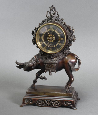 A 19th Century French timepiece with ebonised dial and Roman numerals contained in a bronze case supported by a figure of a water buffalo 28cm h x 16cm w x 10cm d  (no key)