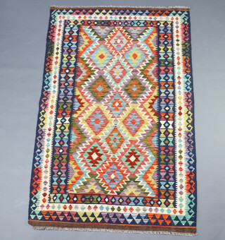A green, tan and black ground Chobi Kilim rug 201cm x 131cm 