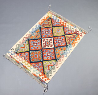 A  white, black and orange ground Chobi Kilim rug with all over geometric design 126cm x 88cm