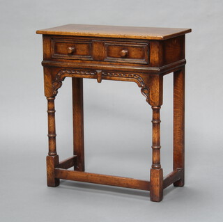 Titchmarsh and Goodwin, a 17th Century style carved oak side table fitted a frieze drawer, raised on turned and block supports with box framed stretcher 71cm h x 61cm w x 30cm d 