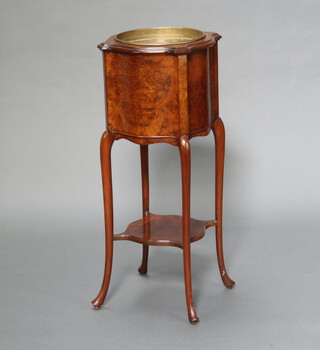 An Edwardian figured walnut jardiniere of serpentine outline and complete with gilt metal liner, raised on turned supports with undertier 89cm h x 36cm w x 37cm d 