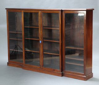 A Victorian mahogany breakfront display cabinet fitted shelves enclosed by glazed panelled doors, raised on a platform base 133cm h x 207cm w x 36cm d 