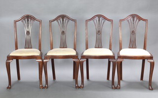 A set of 4 Edwardian Hepplewhite style mahogany camel back dining chairs with pierced vase shaped slat backs and upholstered drop in seats, raised on cabriole supports 96cm h x 44cm w x 43cm d (seat 28cm x 30cm) 