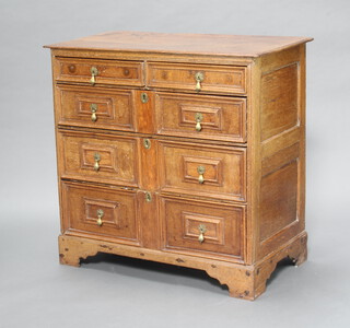 A Jacobean light oak chest of 2 short and 3 long drawers with replacement brass pear drop handles, raised on bracket feet 95cm h x 97cm w x 53cm d 