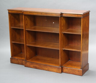A Georgian style figured walnut and oak breakfront bookcase with crossbanded top, fitted adjustable shelves 106cm h x 150cm w x 41cm d (2 holes to the the plywood back) 