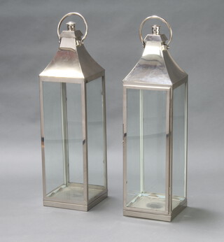 A pair of rectangular polished steel garden lanterns 98cm h x 25cm x 25cm 