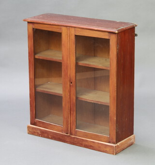 A 19th Century mahogany cabinet fitted shelves enclosed by a pair of panelled doors 73cm h x 67cm w x 23cm d 
