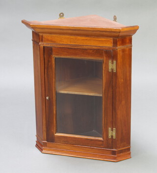 A Georgian style mahogany hanging corner cabinet, interior fitted a shelf with moulded cornice and brass H framed hinges 64cm x 53cm x 58cm 