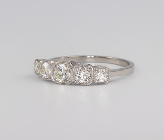 A white metal stamped Plat. graduated 5 stone diamond ring approx. 0.85ct, 3.6 grams, size O 