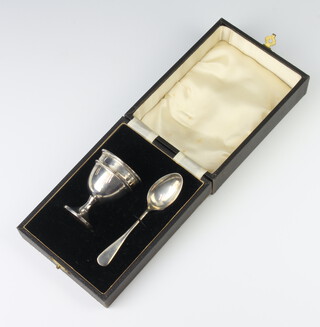 A cased silver egg cup and spoon Birmingham 1936, 32 grams 