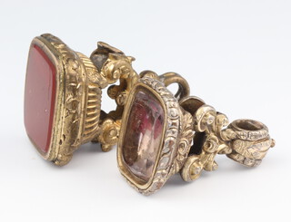 A 19th Century gilt carnelian seal, a ditto with a floral backed quartz