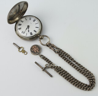 A Victorian silver key wind hunter pocket watch London 1877 with a silver Albert and fob