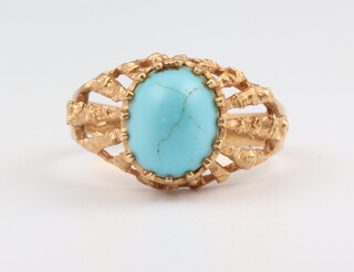 A yellow metal 750 turquoise ring 4.3 grams gross, size O 