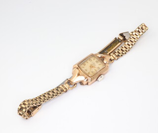 A lady's Avia 9ct gold wristwatch on a gilt bracelet 