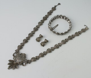 A marcasite necklace, bracelet and pair of earrings 
