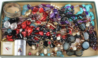 A quantity of vintage costume jewellery including a silver bangle 