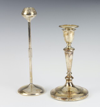 A silver Queen Anne style tapered candlestick London 1936 19cm, a white metal ditto 23cm  