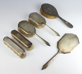 A silver 4 piece engine turned dressing table set London 1946, a hair brush and cloths brush