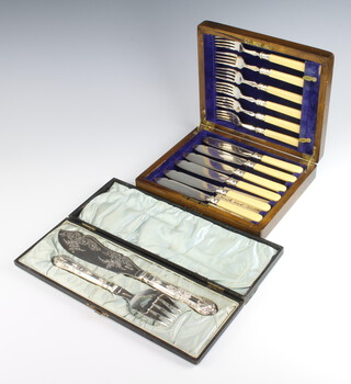A cased pair of silver plated fish servers together with 6 silver plated fish eaters, boxed 