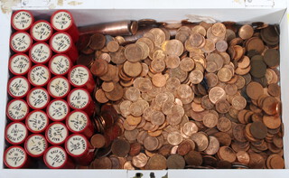 A large quantity of Queen Elizabeth II bronze coinage contained in a wooden box