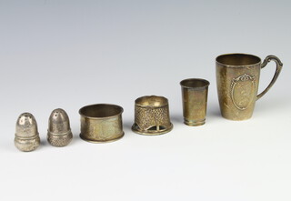 A pair of 830 standard condiments in the form of acorns, a beaker, napkin ring, tot and egg cup 