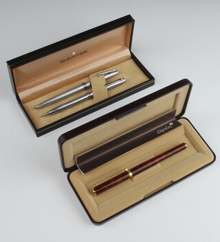 A cased Sheaffer ballpoint pen and propelling pencil no.620 together with an Elysee fountain pen 