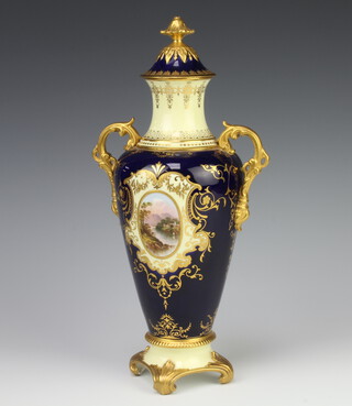 Coalport, a blue and gilt twin handled urn and cover with landscape panel decoration, the base marked England Coalport V.5327 217 32cm h  