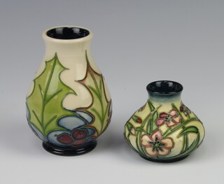 A Moorcroft squat shaped vase with floral decoration, base impressed Moorcroft 205 and with signature 10cm together with 1 other marked to the base 2000 140 (over) 150 6cm h
