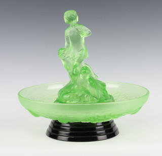 An Art Deco moulded green glass floral centrepiece with figures of children (chipped) the bowl decorated stylised flowers raised on a black base 30cm  